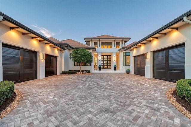 exterior space featuring a garage and french doors