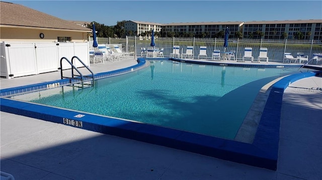 view of swimming pool with a patio area