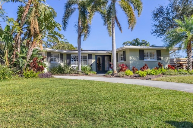 ranch-style home with a front yard