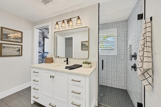 bathroom with vanity and a shower with shower door