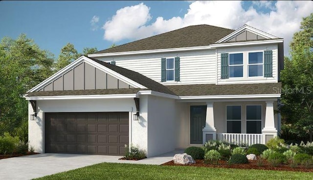 view of front of property with a porch and a garage