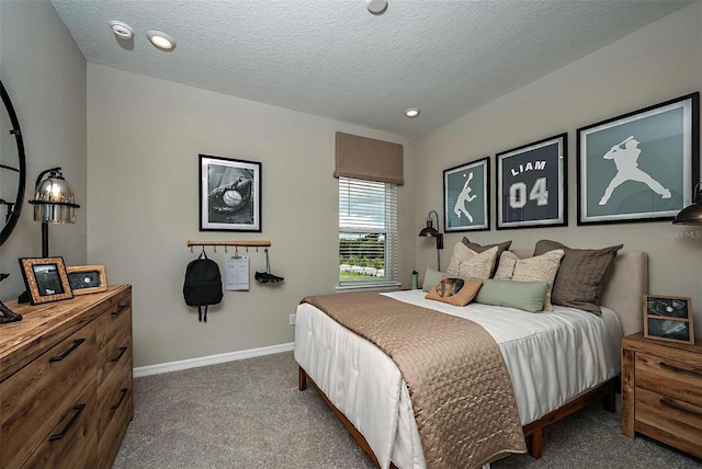 carpeted bedroom featuring a textured ceiling