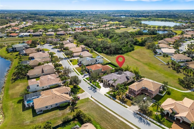 aerial view featuring a residential view and a water view