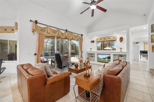 living room featuring light tile patterned floors, high vaulted ceiling, a sunroom, and a healthy amount of sunlight