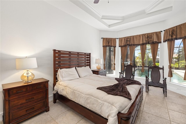 bedroom featuring baseboards, a raised ceiling, ceiling fan, access to outside, and crown molding