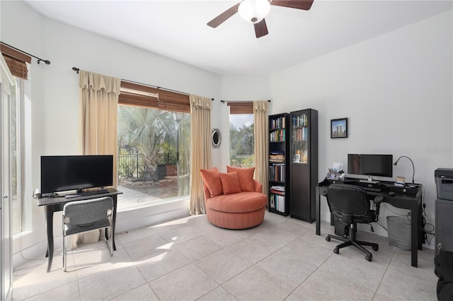 office with light tile patterned floors and a ceiling fan