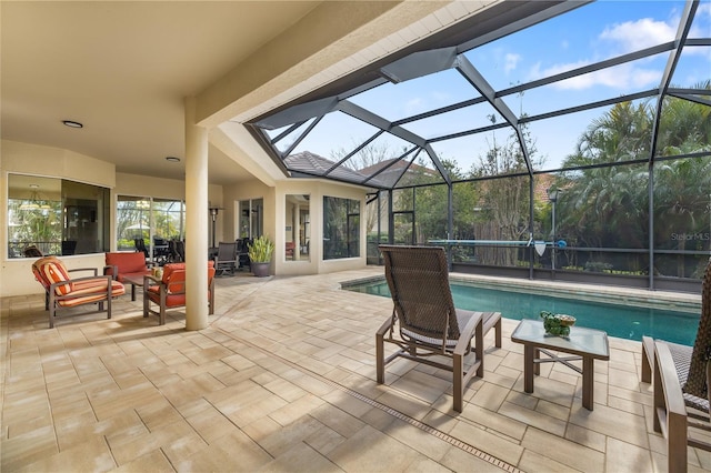 outdoor pool with a lanai, a patio, and an outdoor hangout area