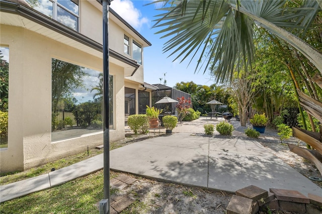 view of patio / terrace with a lanai