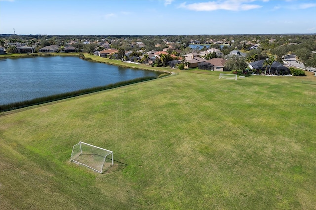 bird's eye view featuring a water view and a residential view