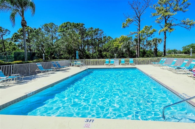 view of swimming pool with a patio area