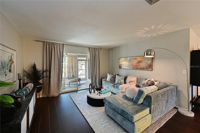 living room with dark hardwood / wood-style flooring