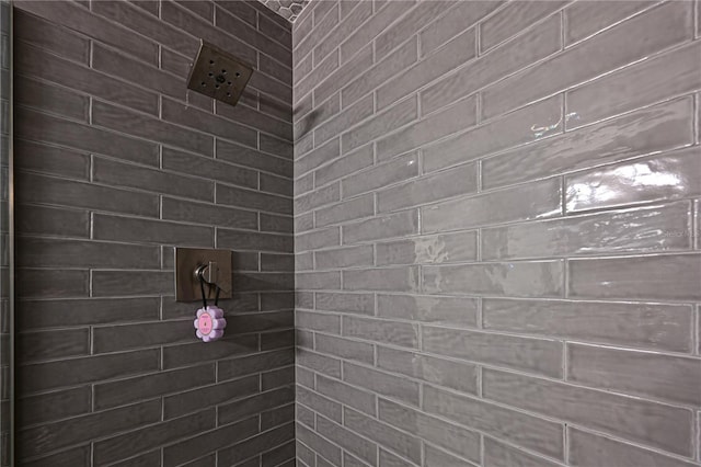 bathroom with a tile shower