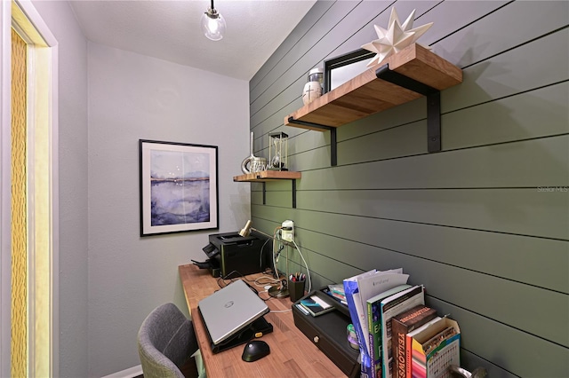 office with hardwood / wood-style flooring and wood walls