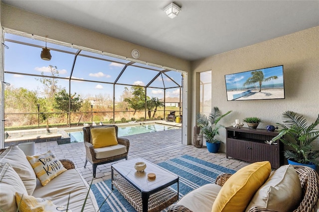 sunroom / solarium featuring an outdoor hangout area and a patio