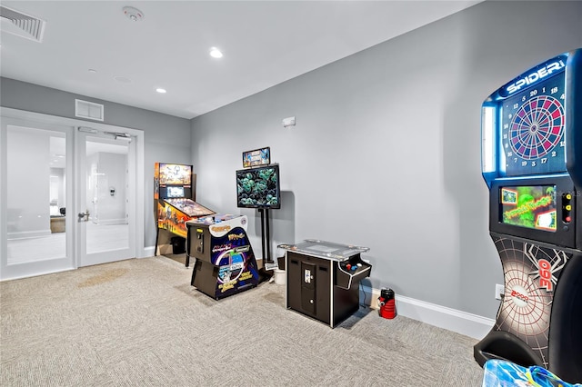 playroom with french doors and light carpet