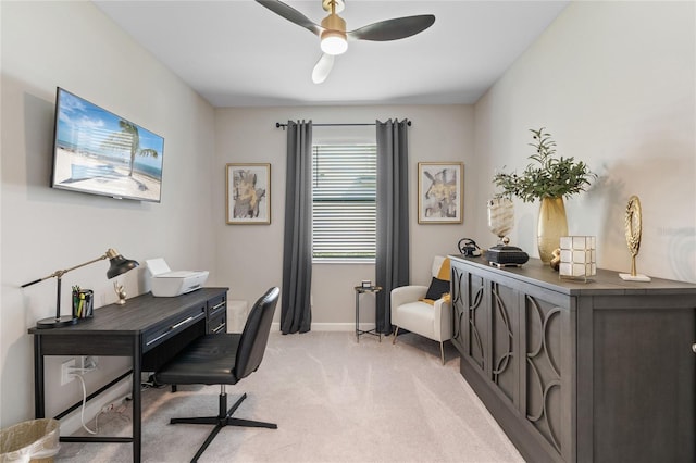 carpeted office featuring ceiling fan