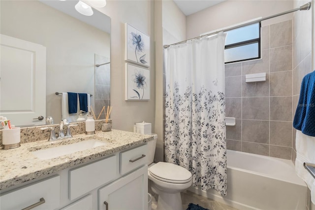 full bathroom featuring vanity, toilet, and shower / bath combo with shower curtain