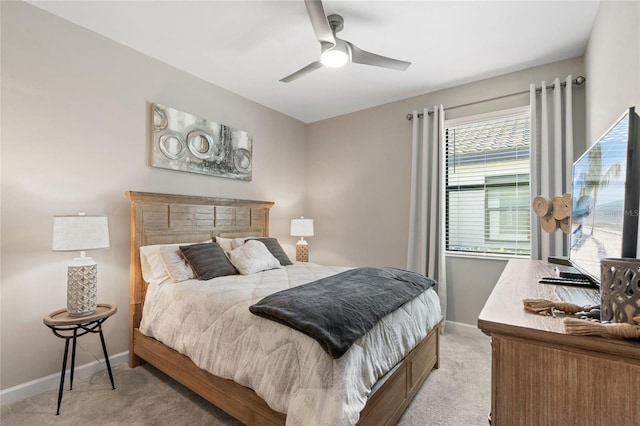 bedroom featuring ceiling fan and light colored carpet