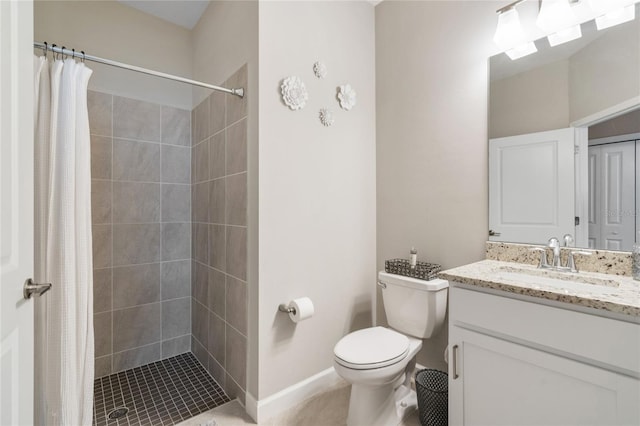 bathroom featuring vanity, curtained shower, and toilet