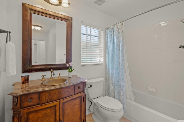 full bathroom with shower / bathtub combination with curtain, vanity, and toilet