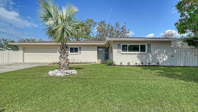 ranch-style house with a front yard and a garage