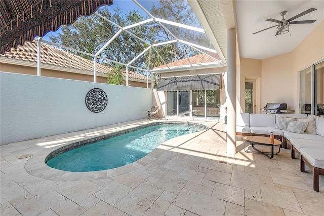 view of swimming pool featuring an outdoor living space, a lanai, a patio area, and a grill