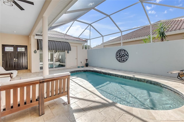 view of swimming pool with a lanai and a patio area