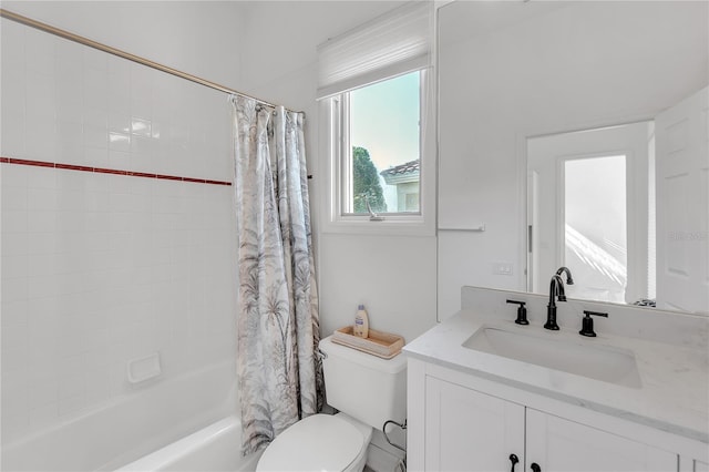 full bathroom featuring vanity, toilet, and shower / bathtub combination with curtain