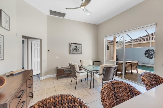 dining space with light tile patterned floors and ceiling fan