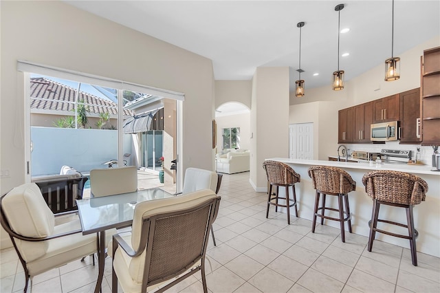 tiled dining room with sink