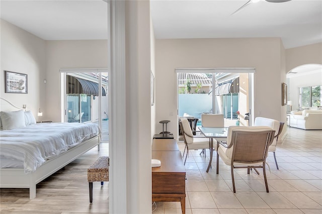 tiled bedroom featuring access to outside