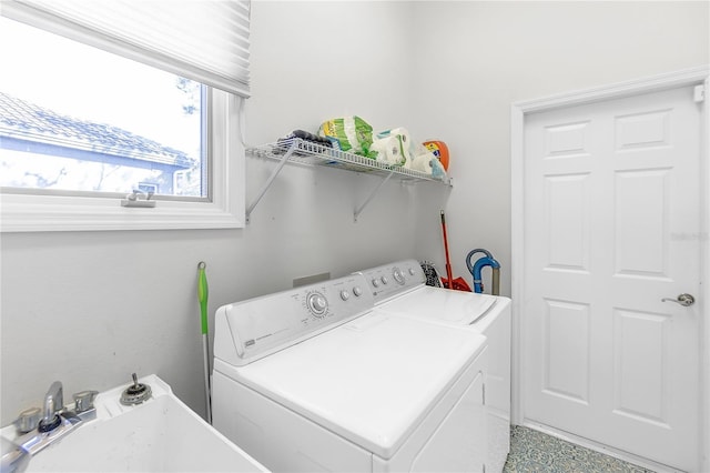 laundry area with sink and washing machine and clothes dryer