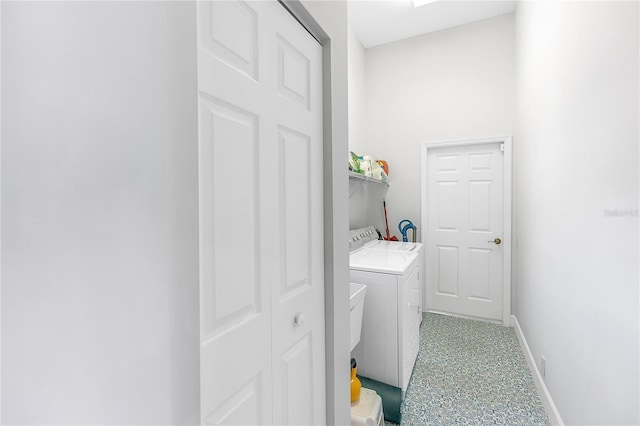 clothes washing area with washing machine and clothes dryer