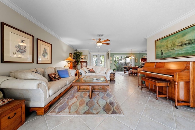 tiled living room featuring crown molding and ceiling fan with notable chandelier