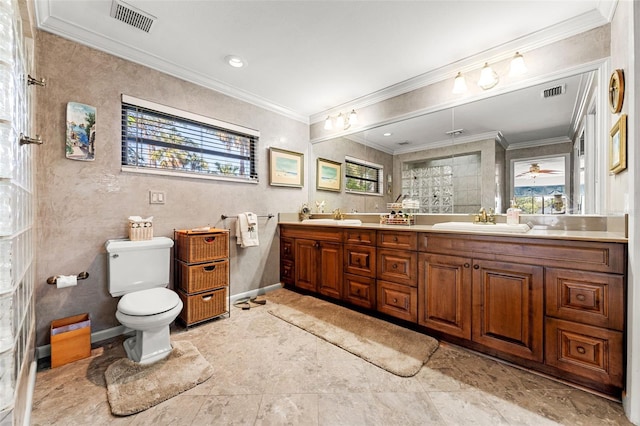 bathroom with vanity, crown molding, toilet, and walk in shower