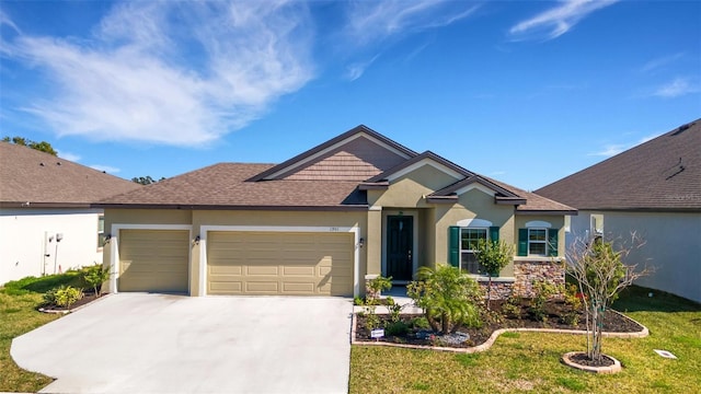 view of front of property with a garage and a front yard