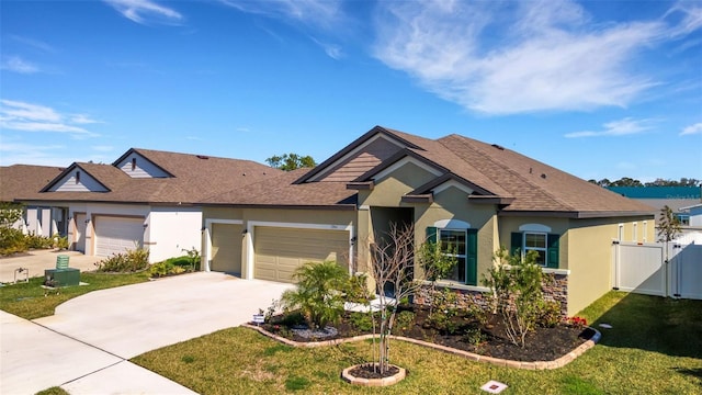 view of front of home with a garage and a front yard