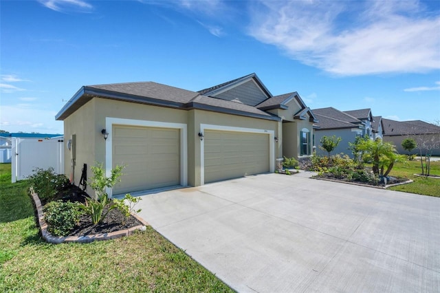 ranch-style house with a garage and a front lawn