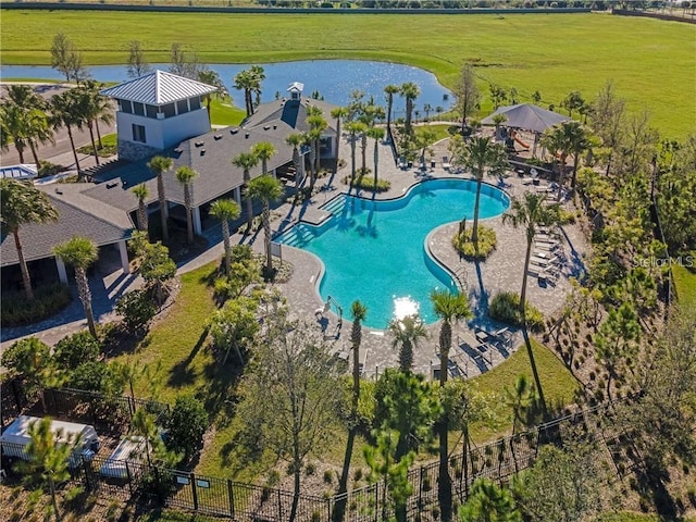 view of pool featuring a water view and a patio area