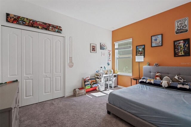 bedroom with a closet and carpet