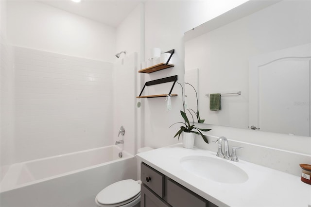 full bathroom featuring vanity, bathtub / shower combination, and toilet