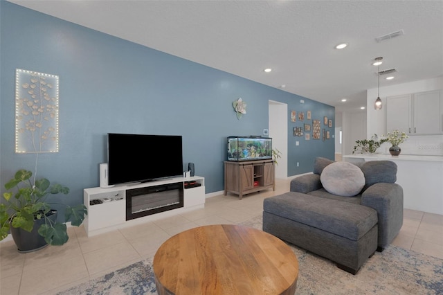 living room with light tile patterned flooring