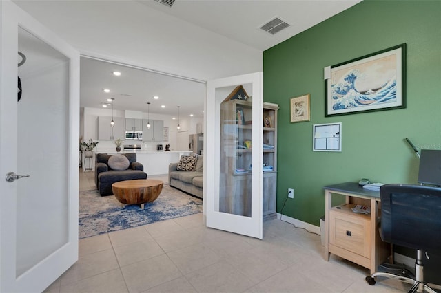 tiled office featuring french doors