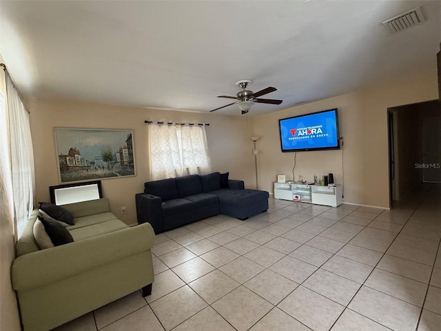 tiled living room featuring ceiling fan