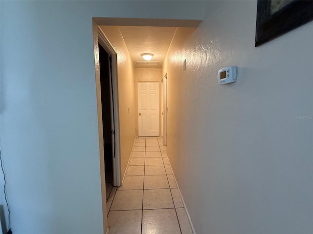 hall with light tile patterned flooring