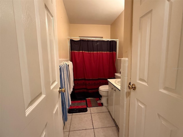 bathroom with vanity, tile patterned flooring, toilet, and a shower with shower curtain