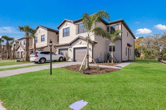 view of front of house with a garage and a front lawn