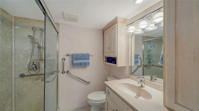 bathroom featuring vanity, an enclosed shower, and toilet