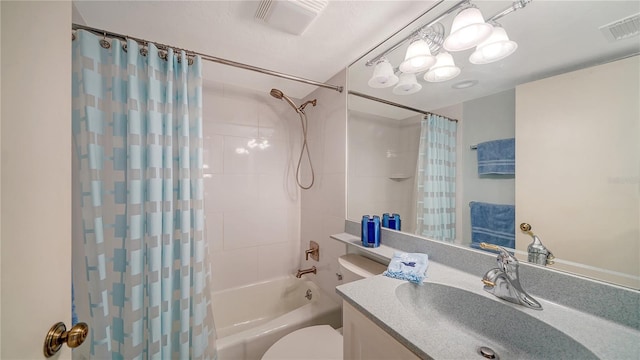 full bathroom featuring shower / bath combo, vanity, and toilet