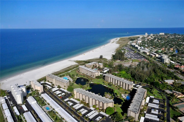 aerial view with a water view and a view of the beach